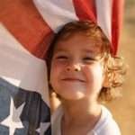 a happy little boy celebrating Independence day